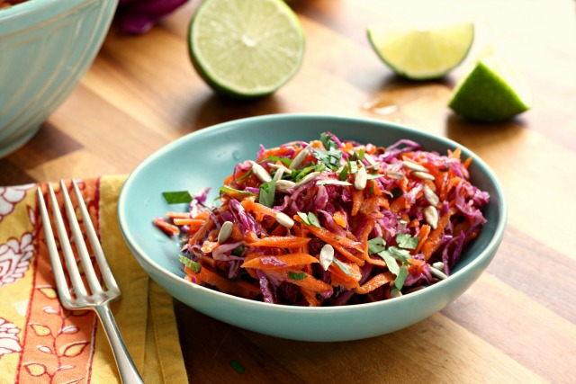 Crunchy carrot-cabbage slaw with maple-mustard vinaigrette is an all-season salad that goes well with all sorts of dishes and looks lovely on a plate.