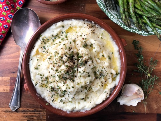 Slightly garlicky cauliflower mash is a good alternative to mashed potatoes. Healthier and much simpler to make this is one of those recipes that goes with almost everything. 