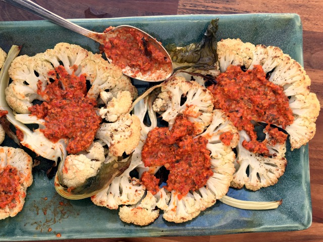 Pumpkin seed Romesco sauce served on roasted cauliflower steaks makes vegetables the star of the meal. 