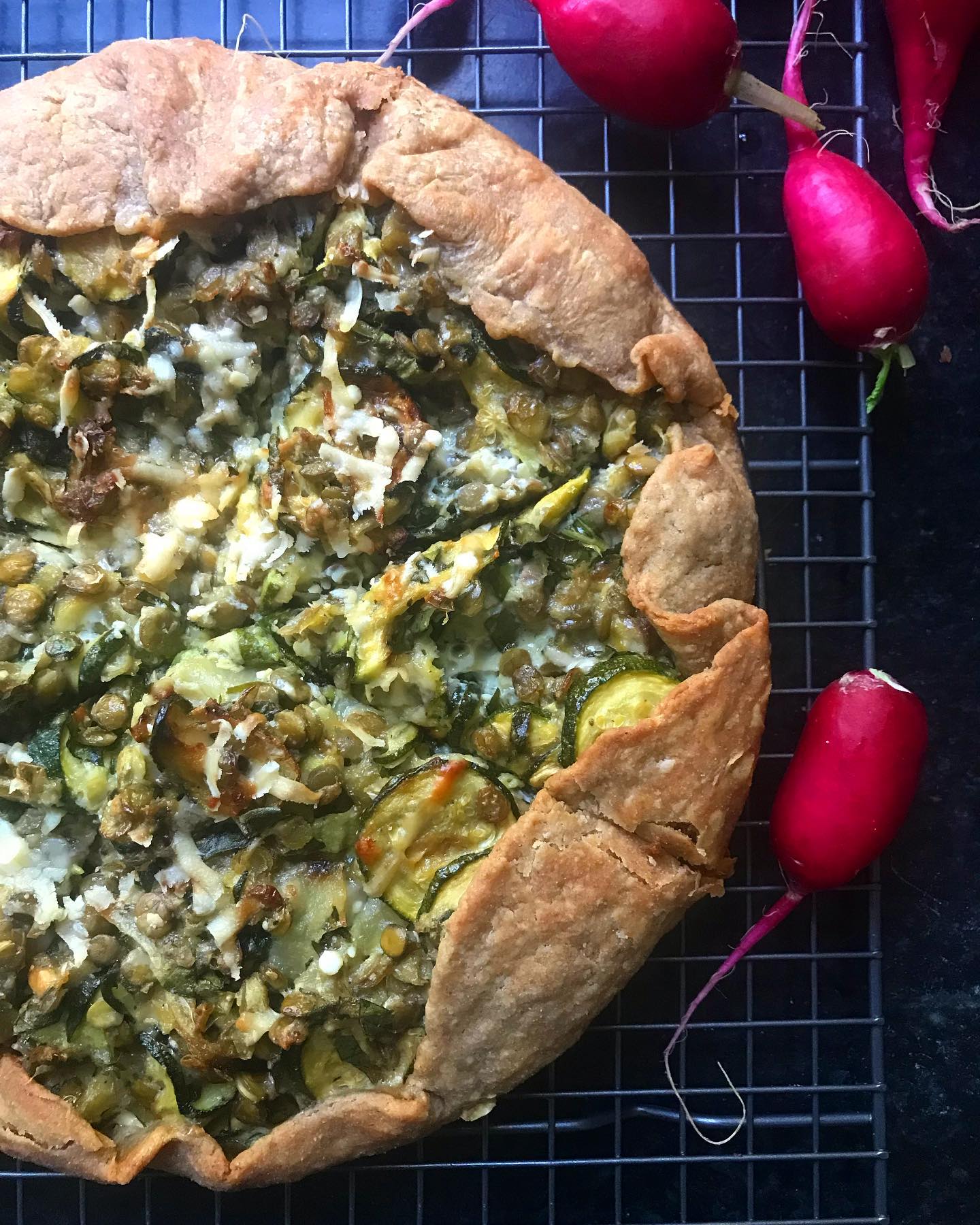 The zucchini galette recipe on my site is super versatile. I was out of feta and low on zucchini so I filled it in with cooked green lentils and loads of Parmesan and basil. You can’t go wrong when you stuff vegetables into buttery pastry. 
.
.
#eatmoreveggies #vegetariansupper #eatmoreplants #lentilsgowitheverything